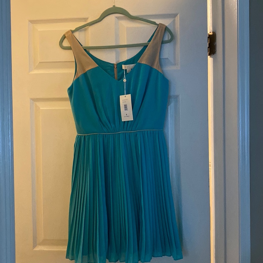 beautiful, never worn turquoise pleated sleeveless dress.